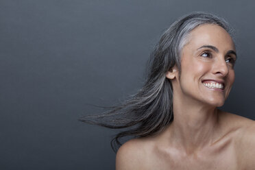 Mature woman with windswept hair - ISF17995