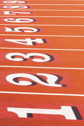 Numbers on running track in sportsground - ISF18276