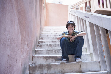 Boy sitting on steps - ISF18383