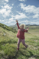 Young girl running to catch bubbles - ISF18414