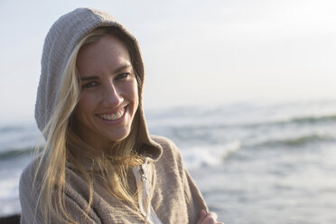 Woman in hoodie on beach - ISF18419