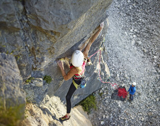 Austria, Innsbruck, Martinswand, woman climbing in rock wall - CVF00998