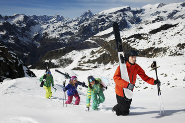 Group of skiers climbing mountain with ski equipment - ISF18531