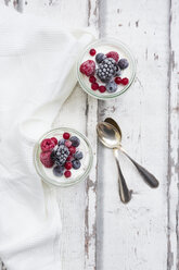 Two glasses of Greek yogurt with frozen berries - LVF07348