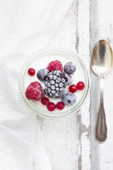 Glass of Greek yogurt with frozen berries - LVF07350