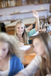 Student putting her hands up - ISF18763