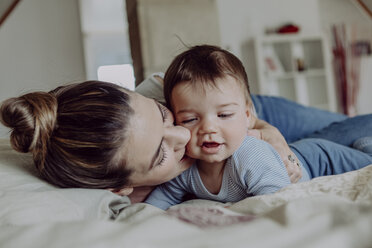 Mother cuddling with her baby son - JLOF00084