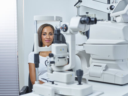 Optician, Young woman before eye test - CVF01030