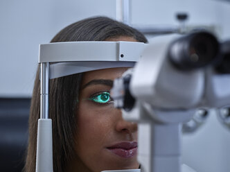 Optician, Young woman during eye test - CVF01036