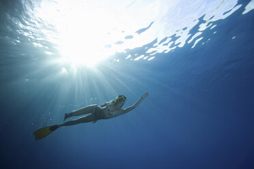 Woman snorkeling underwater - ISF18844