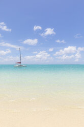 Mauritius, Grand Port District, Pointe d'Esny, sailing boat in turquoise water, blue sky and clouds - MMAF00424