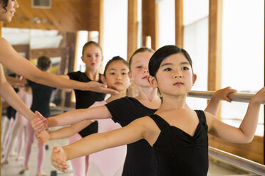 Ballerinas practising at the barre in ballet school - ISF19065