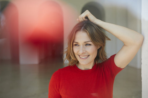 Portrait of smiling woman wearing red shirt stock photo