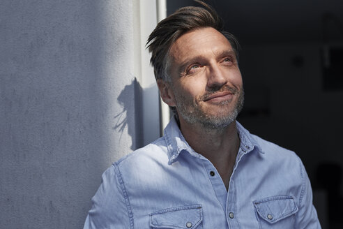 Portrait of smiling man at evening twilight - PNEF00826