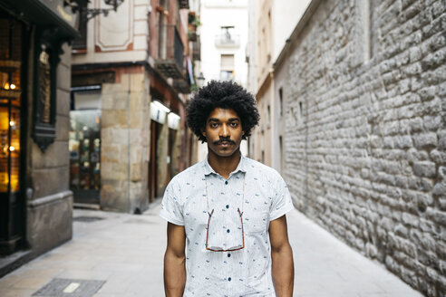 Spain, Barcelona, portrait of man with moustache and curly hair - JRFF01732