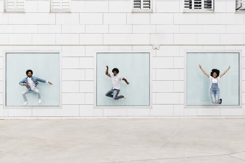 Three friends jumping together in the air - JRFF01761