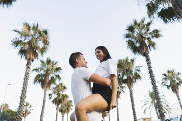 Young couple embracing in park - AFVF01203