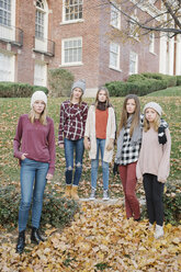 A group of five teenage girls outdoors in woolly hats and scarves. - MINF03428