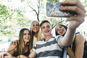 Group of happy friends taking a selfie outdoors - UUF14870