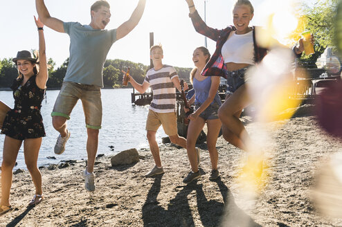 Group of happy friends having fun at the riverside - UUF14880