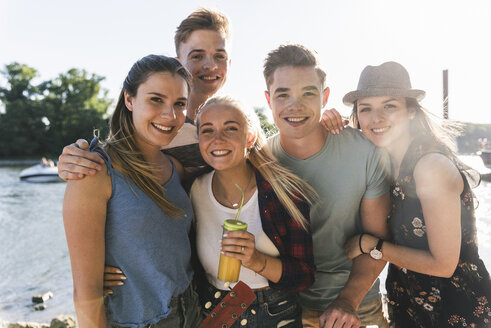 Portrait of group of happy friends at the riverside - UUF14885