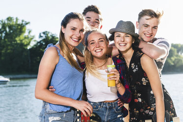 Portrait of group of happy friends at the riverside - UUF14888