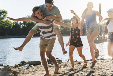 Group of happy friends having fun at the riverside - UUF14911