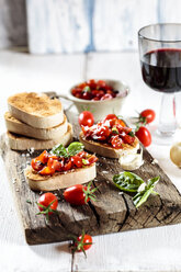 Italian buschetta and glass of red wine - SBDF03718