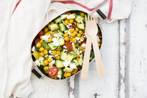 Lunch box of salad with chick peas roasted with curcuma, feta, cucumber, tomatoes and parsley - LVF07371