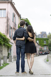 France, Paris, young couple in an alley in the district Montmartre - AFVF01252
