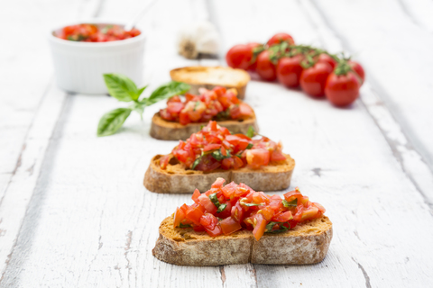 Bruschetta with tomato, basil, garlic and white breah stock photo