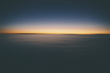 The view across the surface of Bonneville Salt Flats to the sunrise dawn light. - MINF04765