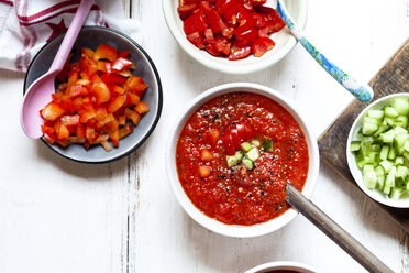 Bowl of Gazpacho with cucumber and bell pepper topping - SBDF03726