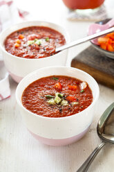 Bowl of Gazpacho with cucumber and bell pepper topping - SBDF03728