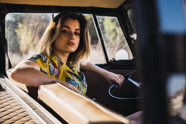 Portrait of young woman in a van - KKAF01369