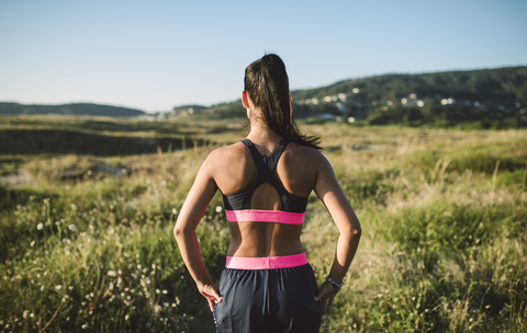 Porträt einer Joggerin, Rückansicht, lizenzfreies Stockfoto