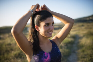 Portrait of a smiling jogger - RAEF02061