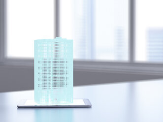 3D rendering, Hologram of building on digital tablet on desk - UWF01495