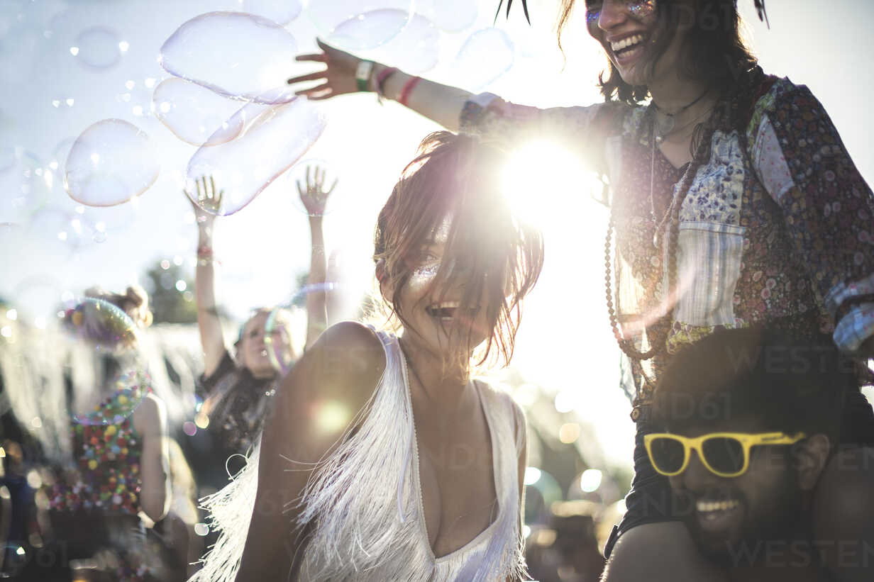 Man at music festival wearing hat with four different pairs of glasses  Stock Photo - Alamy