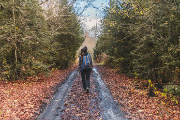 Spain, Ordesa y Monte Perdido National Park, back view of woman with backpack in autumn - AFVF01293