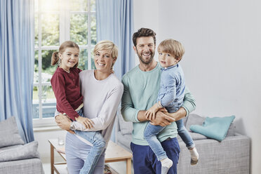 Portrait of happy family with two kids at home - RORF01385