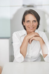 Portrait of mature businesswoman wearing white blouse - PNEF00852