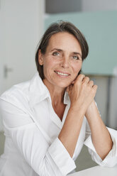Portrait of mature businesswoman wearing white blouse - PNEF00853
