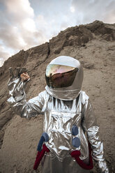 Spaceman on a nameless planet, taking rock samples - VPIF00488