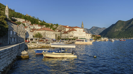 View of boats in harbour and town of Perast in the Bay of Kotor, Montenegro. - MINF06511