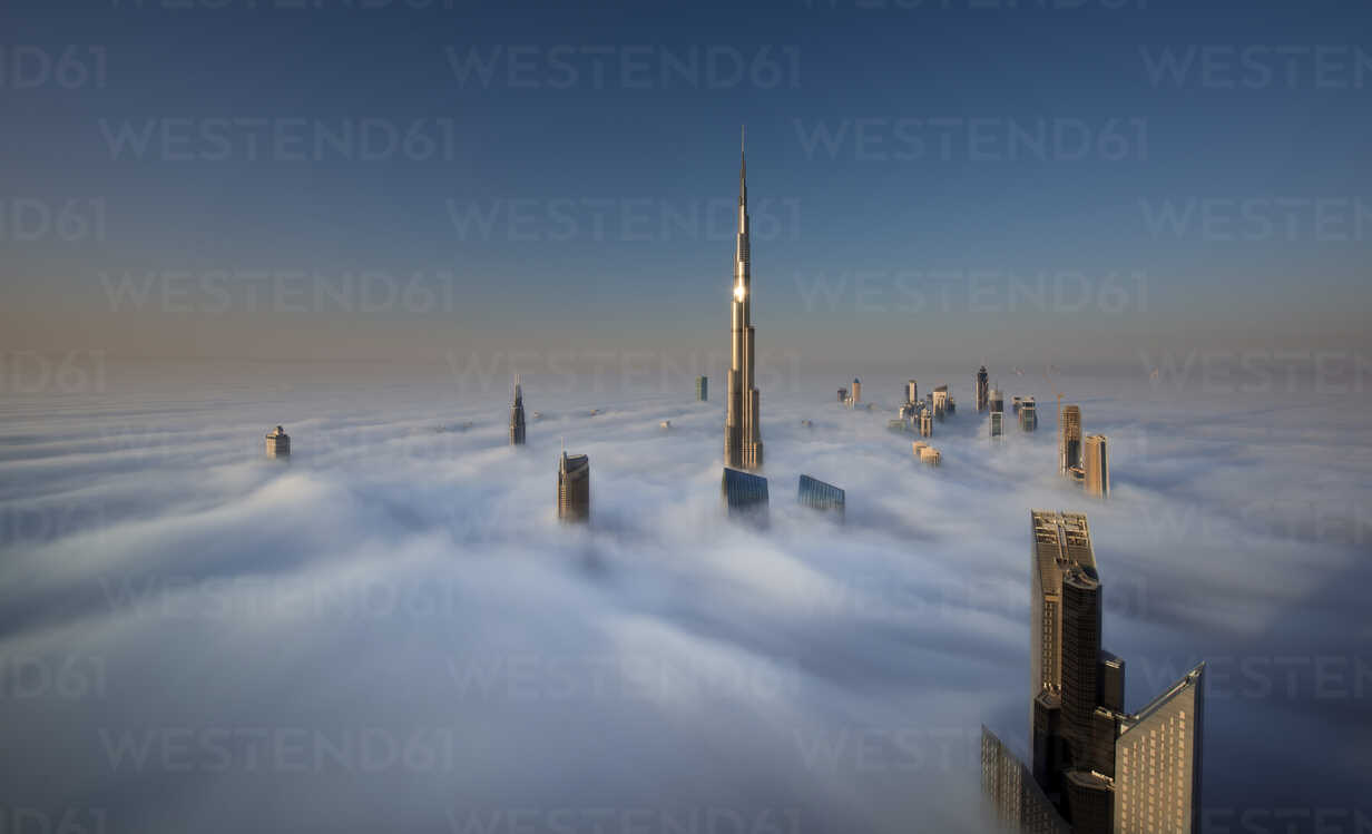 View of the Burj Khalifa and other skyscrapers above the clouds in ...