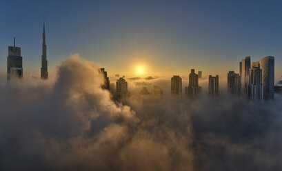 View of the Burj Khalifa and other skyscrapers above the clouds in Dubai, United Arab Emirates. - MINF06514