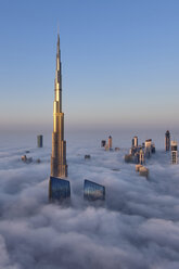 View of the Burj Khalifa and other skyscrapers above the clouds in Dubai, United Arab Emirates. - MINF06526