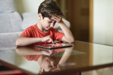 Little girl using digital tablet at home - JSMF00392