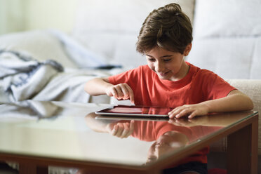 Little girl using digital tablet at home - JSMF00393